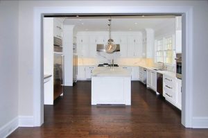 Kitchen in Colonial spec house in Greenwich CT by DeMotte Architects
