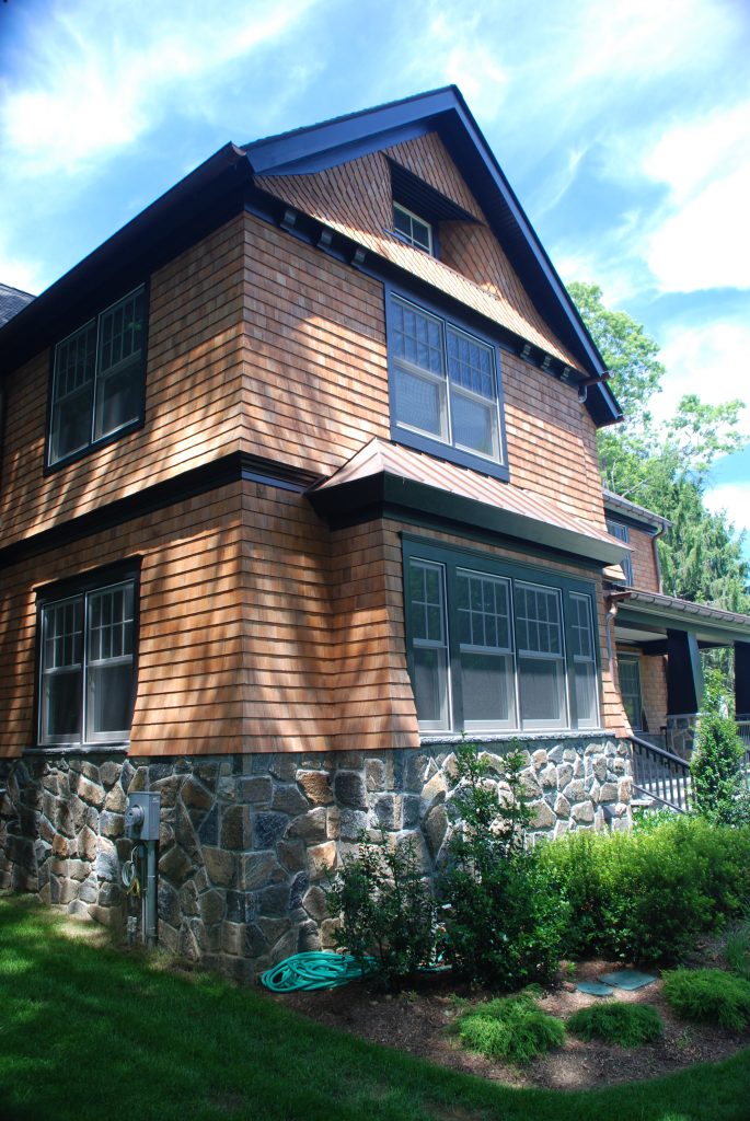 large windows in shingle style home in rye ny by demotte architects