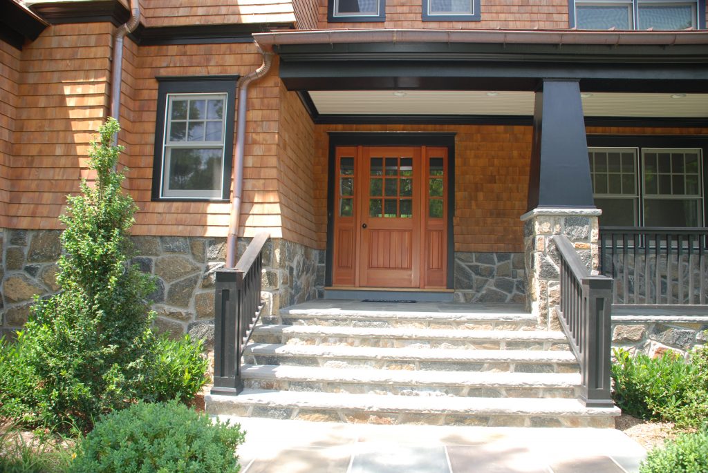 front door of shingle style home in rye ny by demotte architects