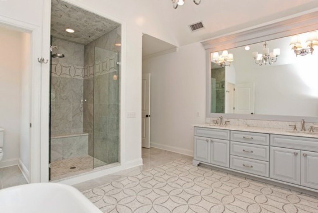 Master bathroom in Rye NY Colonial home by DeMotte Architects