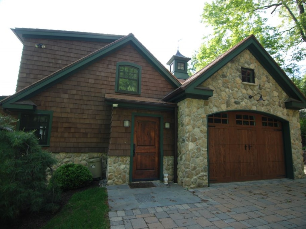 New Fairfield CT shingle style home with carriage style garage doors
