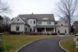 front of shingle style home in westport ct by demotte architects