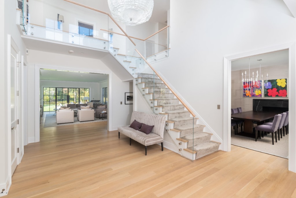 Contemporary foyer in Greenwich CT modern farmhouse by DeMotte Architects