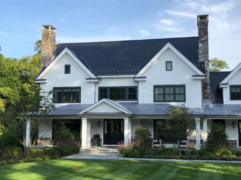 Modern farmhouse with large windows home design by DeMotte Architects