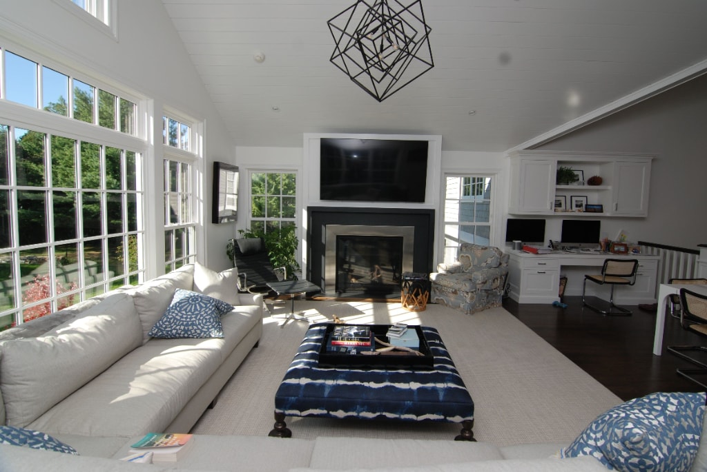 Beautiful family room with large window home design by DeMotte Architects